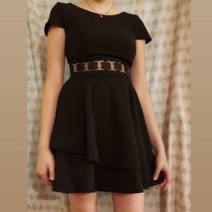 Black dress with lace detailing.